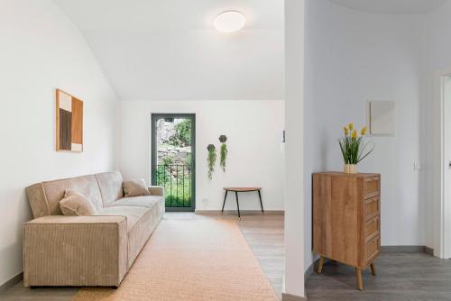 a living room with a couch and a table at Casa do Recanto - Loriga - Serra da Estrela in Loriga