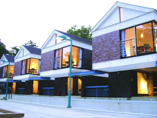 a building with a street light in front of it at Sundance Resort Yamanakako in Yamanakako