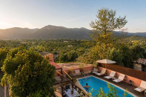 an outdoor swimming pool with a view of the mountains at Hotel Moscari Nature & Wellness by CheelHotels in Moscari