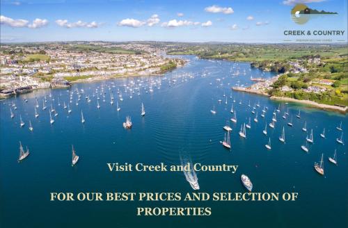a view of a river with boats in the water at Riversdale in Falmouth