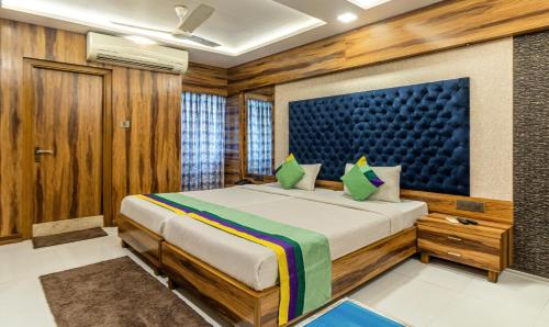 a bedroom with a large bed in a room at Hotel Orion Crystal in Kolkata