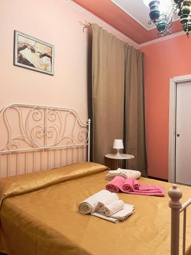 a bedroom with a bed with two towels on it at Stella Marina in Giardini Naxos