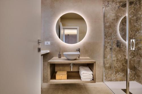 a bathroom with a sink and a mirror at Monolocale 3 - viale Turati, Lecco in Milan