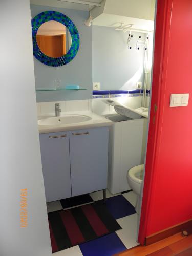 a bathroom with a sink and a toilet at Studio Face Mer in Quend-Plage