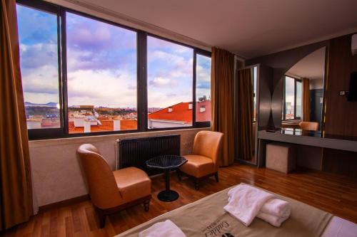 a hotel room with a view of a large window at Cadde 7 Otel in Bahçelievler
