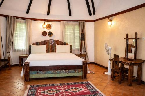 Postel nebo postele na pokoji v ubytování Selous Kinga Lodge