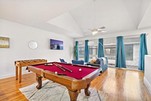 a living room with a pool table at Houston Getaway by Downtown Pool Table Pets in Houston