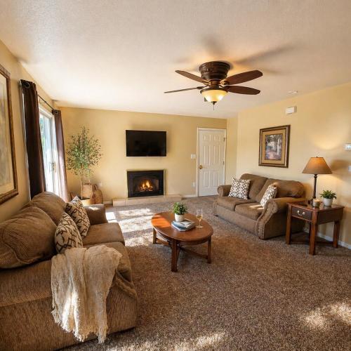 a living room with a couch and a fireplace at Buccaneer Bay #28 - Beachfront Bliss in Sunrise Beach