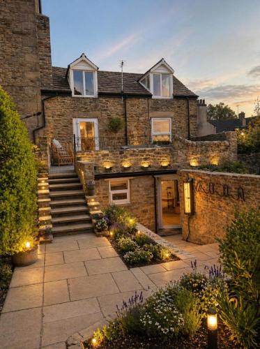 a stone house with lights in front of it at Lilac Cottage in Barnard Castle