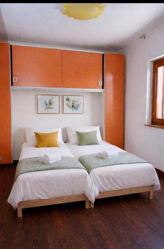 a bedroom with a large bed with wooden headboards at Escape Anzio- intero appartamento in Anzio