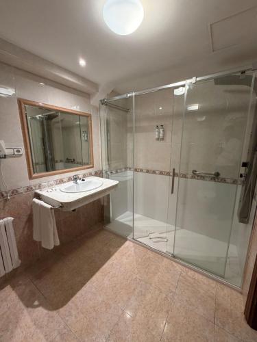 a bathroom with a sink and a shower at Hotel Riveiro in Sanxenxo