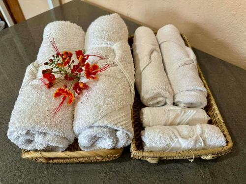 a group of towels sitting on a table at Bananaland Cottages in Panglao Island