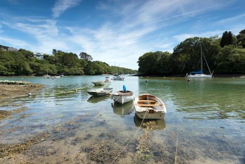 a group of boats sitting in the water at Stylish Central Famouth Studio with Parking | WiFi | in Falmouth