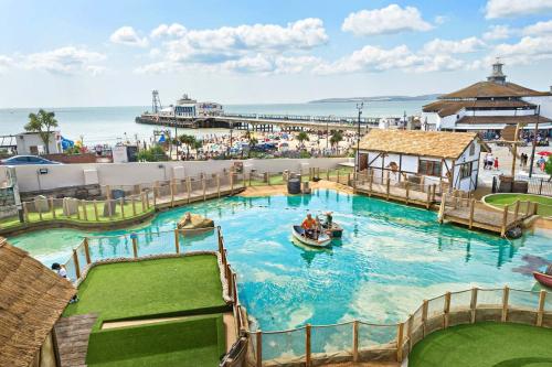 a water park with a boat in the water at Apartment Nine Pelican House in Bournemouth