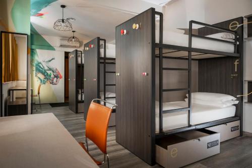 a group of bunk beds in a room at The RomeHello in Rome