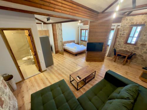 a living room with a couch and a table at Eleon apartments in Kalamata