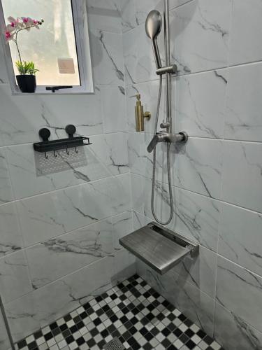 a bathroom with a shower with a bench in it at Bavarian Getaway in Kloof