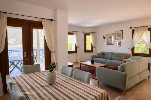 a living room with a table and a couch at Villa Noa Amazing Sea view in Kaş