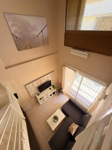 an overhead view of a living room with a couch and a fireplace at Ocean Corner Dúplex Empul in Los Caños de Meca