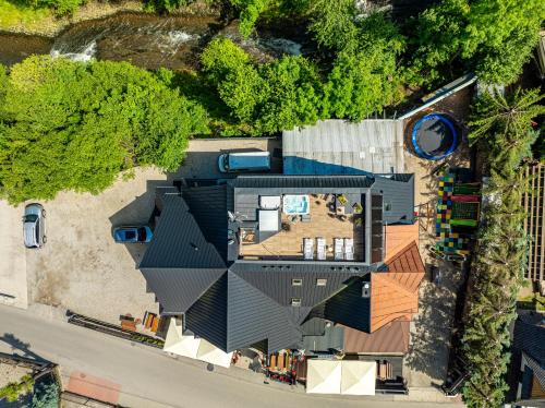an overhead view of a house with a black roof at Residence Spa Harenda in Zakopane