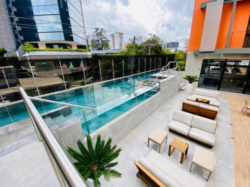 a swimming pool on top of a building at EON Two Bedroom Apartment 1303 in Estación Pamplona