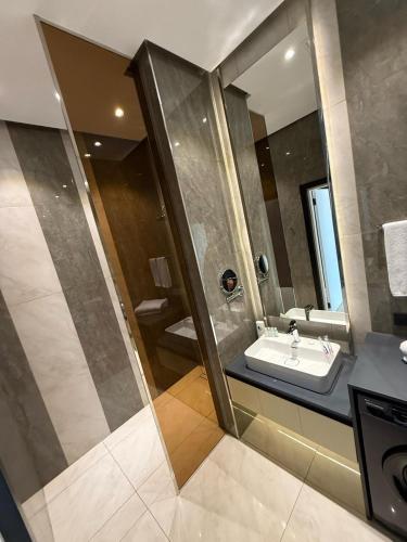 a bathroom with a sink and a mirror at Sea Breeze Lighthouse in Nardaran