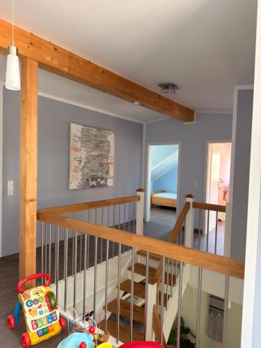 a room with a staircase and a bedroom at Ferienhaus Pirat Störtebeker Dangast in Dangast