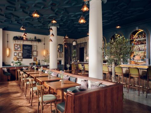 a row of tables and chairs in a restaurant at The Cadogan, A Belmond Hotel, London in London
