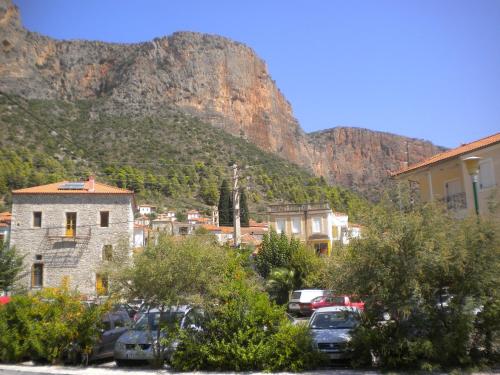 a view of a city with a mountain in the background at Stone House in a quiet landscape, Leonidion in Leonidion