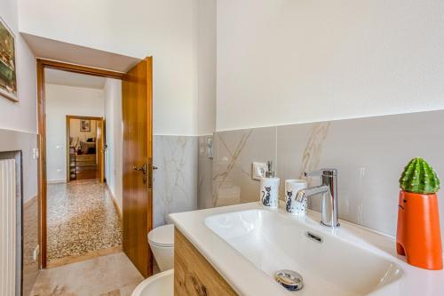 a bathroom with a sink and a toilet at Tuscan Treasure Tower in Colle di Val d'Elsa
