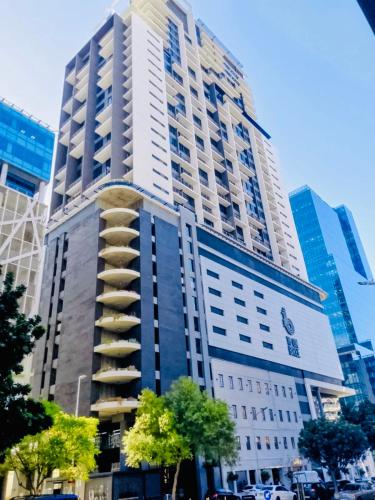 a tall building with a spiral in a city at Urban Elephant 16 On Bree in Cape Town