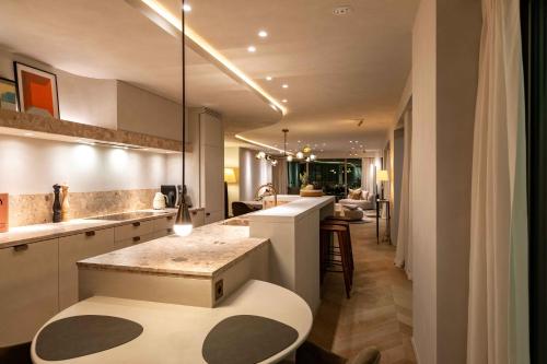 a kitchen with a large island in a room at O'Ciel 24 - Exceptional 24th floor Residence - Ostend in Ostend