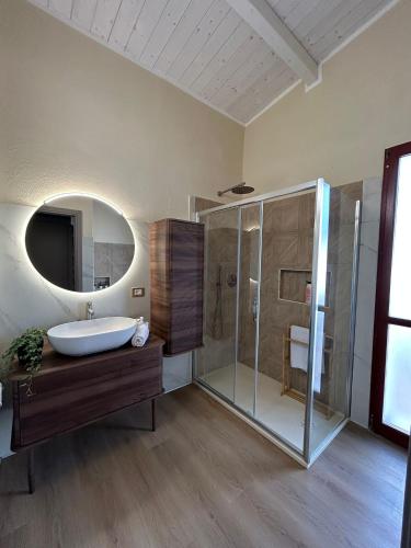 a large bathroom with a sink and a shower at Luce di Mare in Quartu SantʼElena