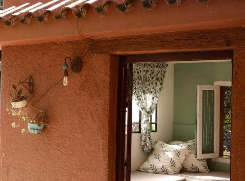 a room in a house with a window at Estancia Urbana Hotel Boutique in Río Cuarto