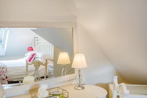 a bedroom with a bed and a large mirror at 3 Bed in Langholm oc-c41365 in Langholm