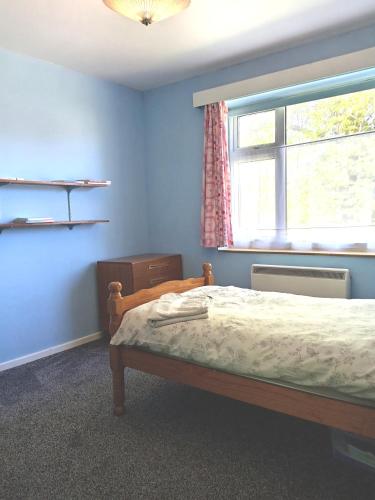 a bedroom with a bed and a window at Double Bed in Sawston