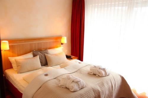 Postel nebo postele na pokoji v ubytování Hotel Villa Gropius