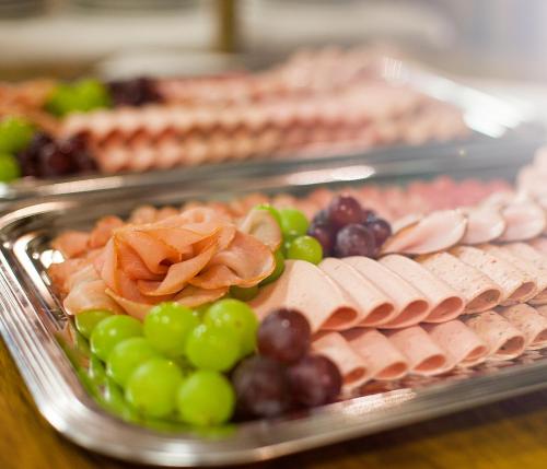 a display of meats and grapes and other food items at Zum Bräu-Toni in Dietfurt