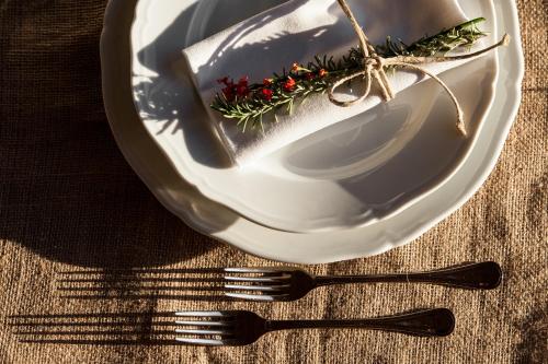 a plate and a fork on a table at Tenuta Agricola dell'Uccellina in Talamone