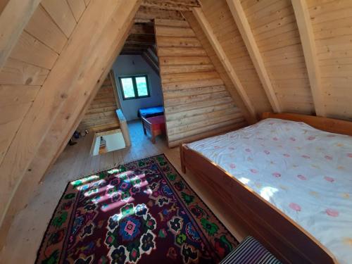 an overhead view of a bedroom in a log cabin at Peaceful Cottage in Bijelo Polje