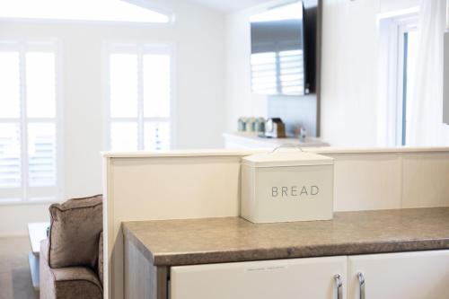a kitchen with a bread box on a counter at Quayside in Christchurch