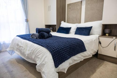 a bedroom with a bed with two dogs laying on it at Quayside in Christchurch