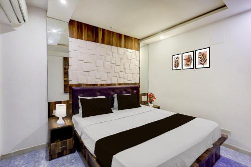 a bedroom with a large bed in a room at Collection O Chidambaram Stadium Formerly Hotel Admire Suit in Chennai