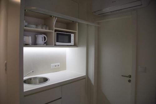 Η κουζίνα ή μικρή κουζίνα στο Hotel Spot Family Suites
