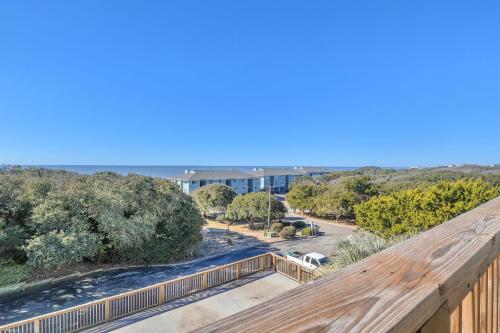 a view of the beach from the balcony of a house at Sea-Nic View by Oak Island Accommodations in Caswell Beach