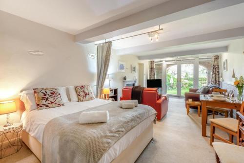 a bedroom with a bed and a living room at 1 Bed in Keswick oc-28382 in Braithwaite