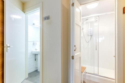 a bathroom with a shower and a glass door at 1 Bed in Keswick oc-28382 in Braithwaite