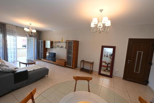 a living room with a couch and a table at 50 meters to the beach 3 bedroom appartment in Limassol