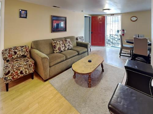 a living room with a couch and a coffee table at A Step Above in Ruidoso