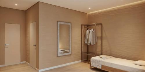 a bedroom with a bed and a mirror at Kilemche Boutique Hotel & Yurt Camp in Bagysh